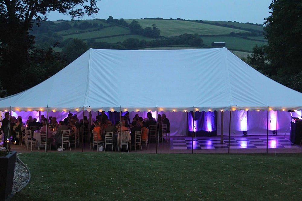Image of a traditional marquee with additional mood lighting.