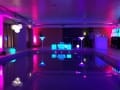 LED Cocktail Bar with LED Furniture and Mood Lighting in a swimming pool.