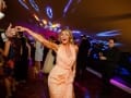Wedding guest with arms in the air!