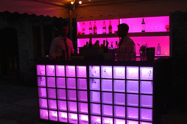 Image of cocktail bar and barmen at private party.