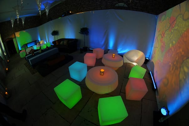 Sophisticated Venue Styling at Brympton House: Elevate your event with LED furniture, oil projections, and plush, oversized cushions. Brympton House is transformed into a sophisticated haven where modern aesthetics and artistic ambiance blend seamlessly, creating a uniquely styled venue that captivates and delights.